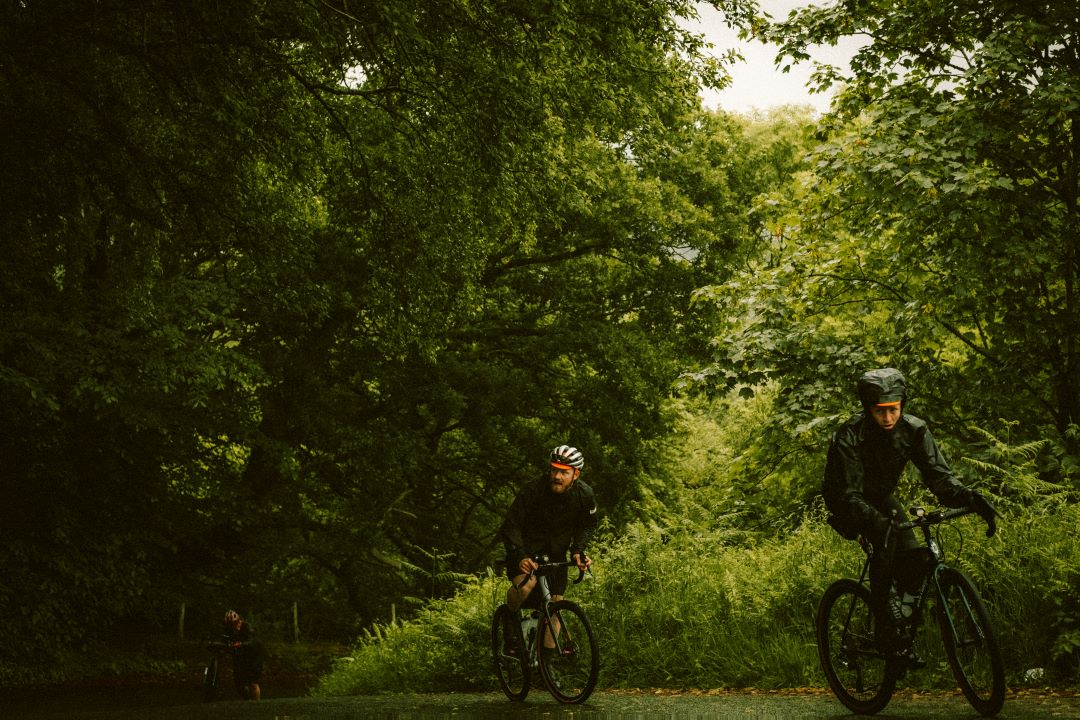 two male cyclists training in the woods