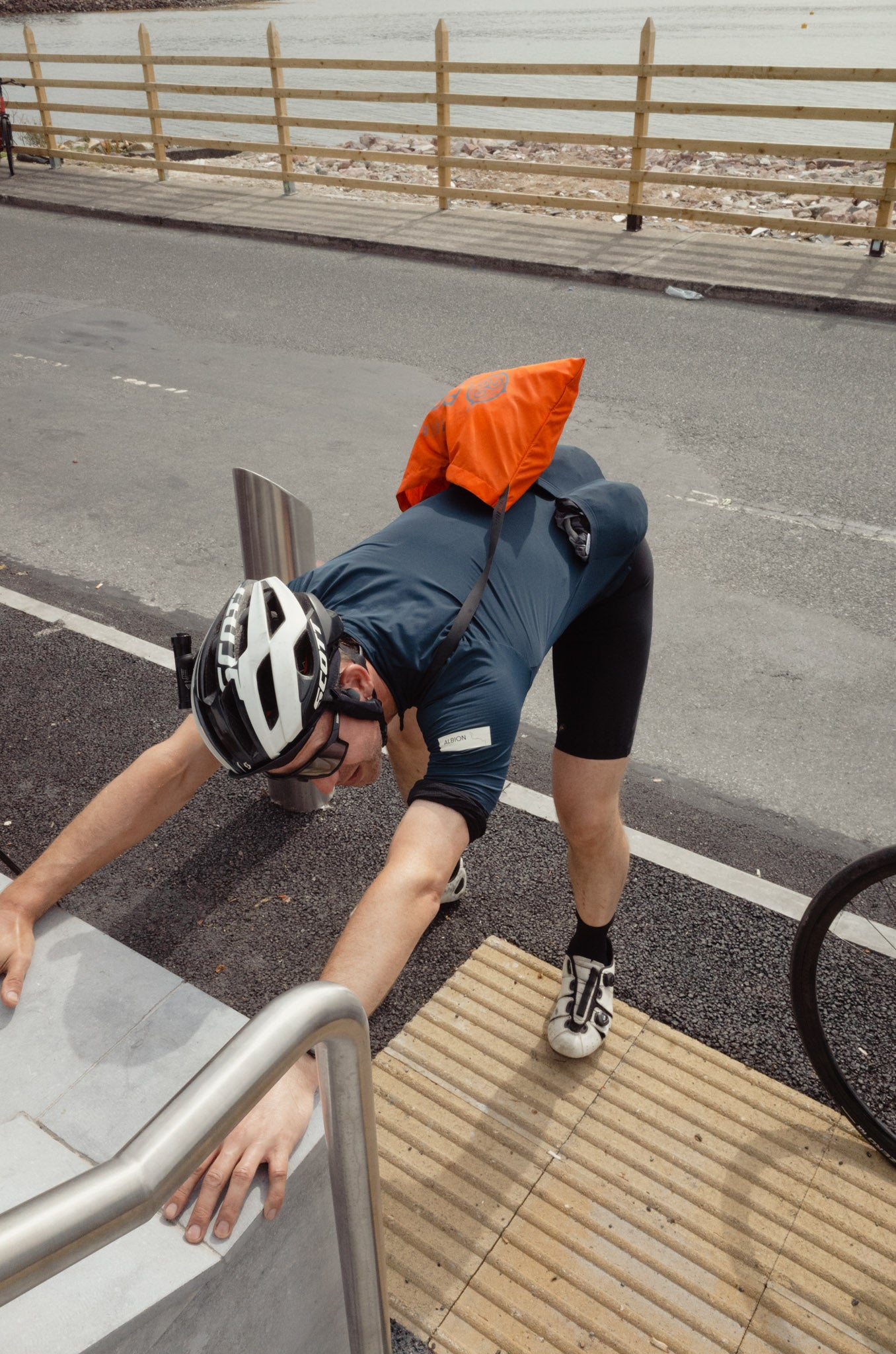 cyclist stretching before a ride