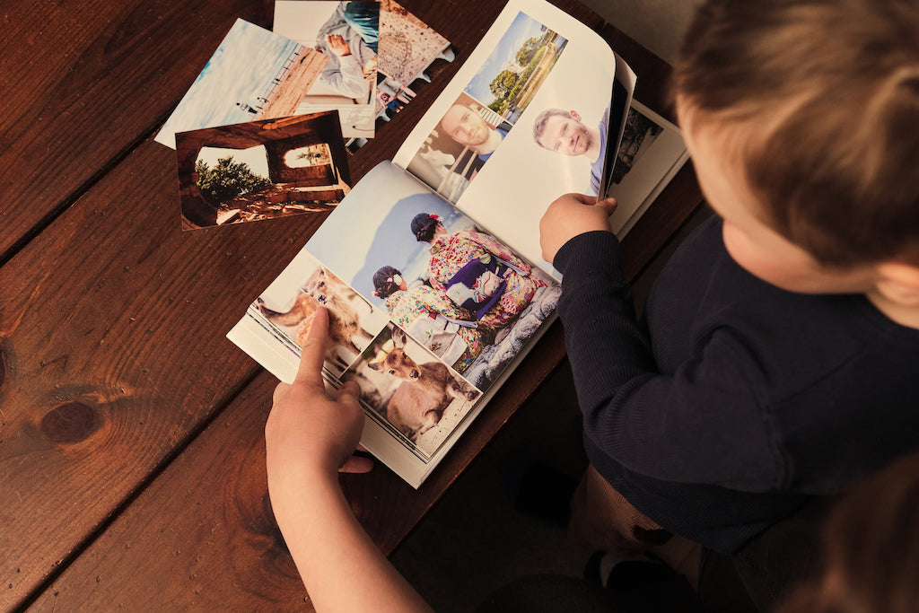 Toddler with open photo book