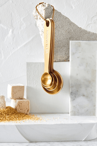 https://cdn.shopify.com/s/files/1/0551/0856/7143/t/64/assets/ace92677_brushed-gold-measuring-spoons_shot3_hb-1673270541318_315x.png?v=1673270543