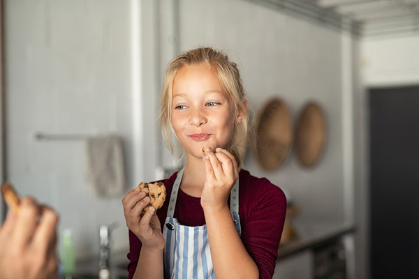 little girl eating cookies