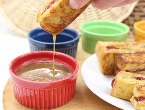 dipping French toast sticks made from a white bread machine mix