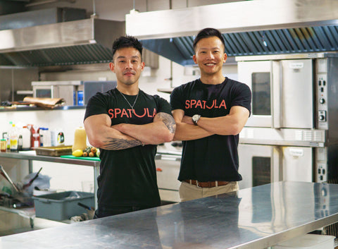 Pictured: Chef Wallace Wong (left) and Ian Weng (right) stand proudly in the first SPATULA kitchen.