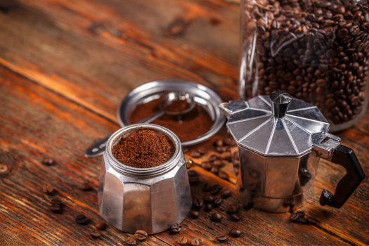 moka pot highlighting coffee grounds in the lower chamber filter basket