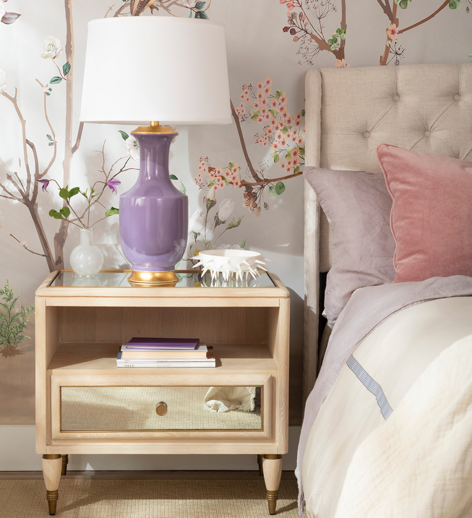 Nightstand with Purple Lamp and Floral Wallpaper
