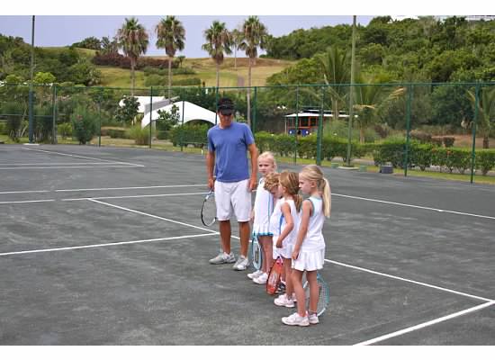 Our kids playing tennis with friends visiting and "coach" Jon Pastel