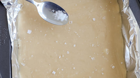Sprinkling salt on top of fudge