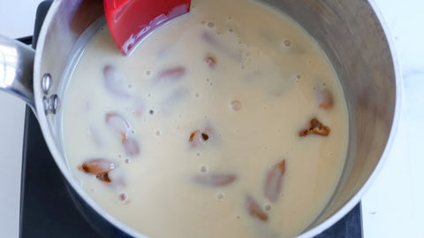 Combine condensed milk with caramels