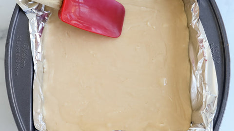 Spreading fudge in foil lined pan