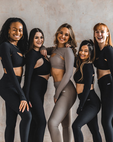 Dancers pose in the DYNS purpose collection