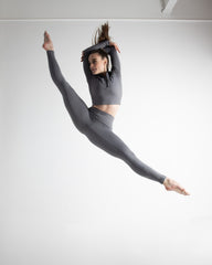 Sasha Woodward dances in DYNS quarter zip top and leggings.