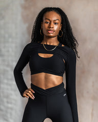 Dancer poses in the DYNS purpose collection in black colour.