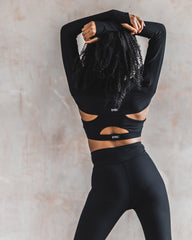 DYNS dancer showing black leggings from purpose collection.