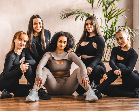 Dancers pose in DYNS purpose collection.