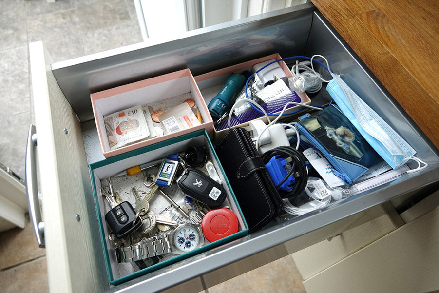 junk drawer with dirty containers