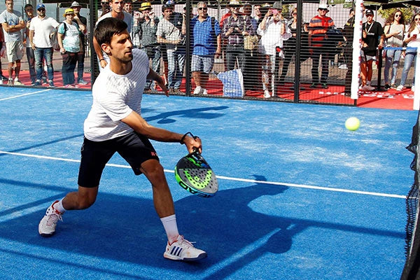 Novak Djokovic playing paddle