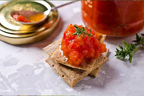 Cacio e Pepe Crackers with Tomato Pesto