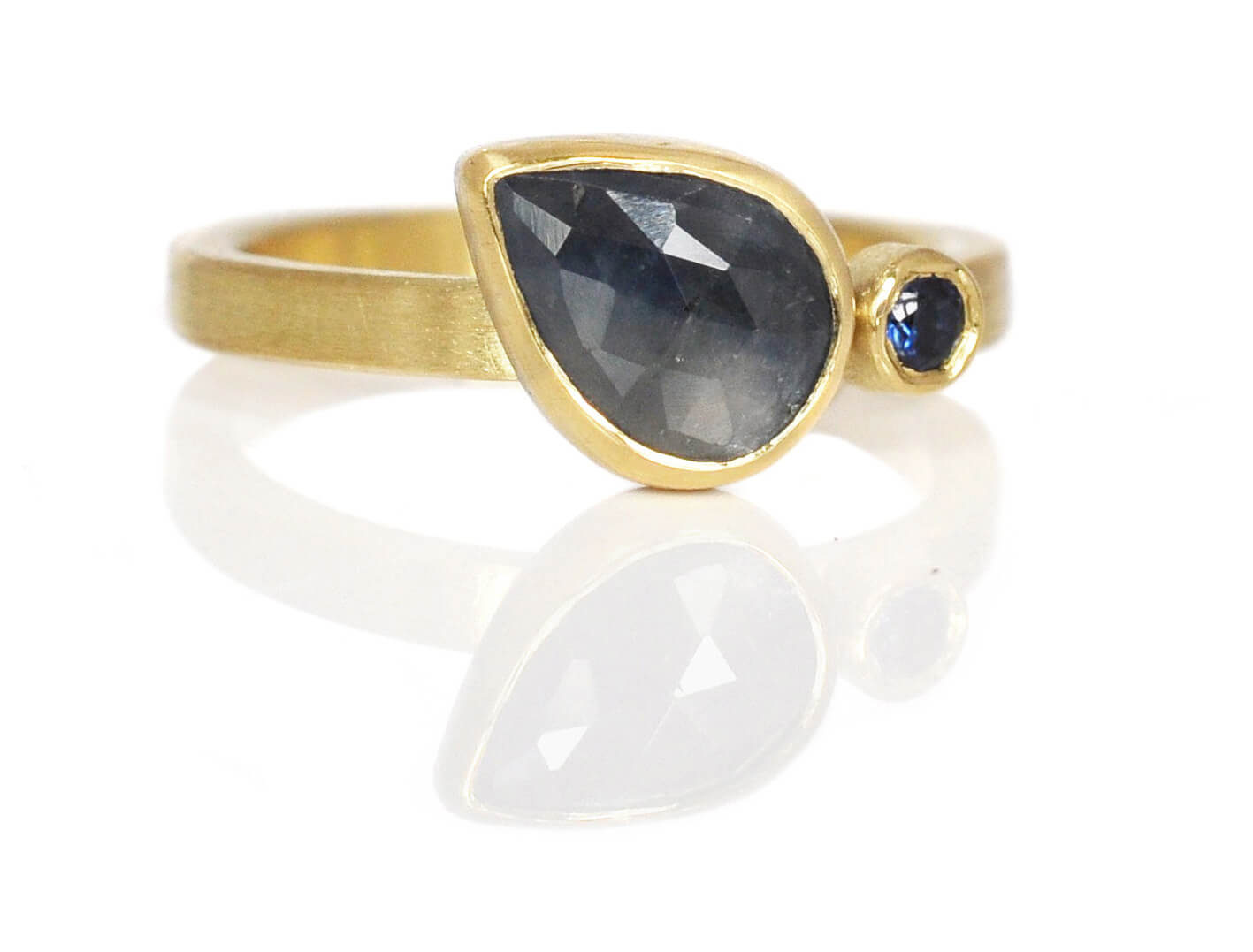 Rose cut sapphire engagement ring in yellow gold with a brilliant cut sapphire accent stone.