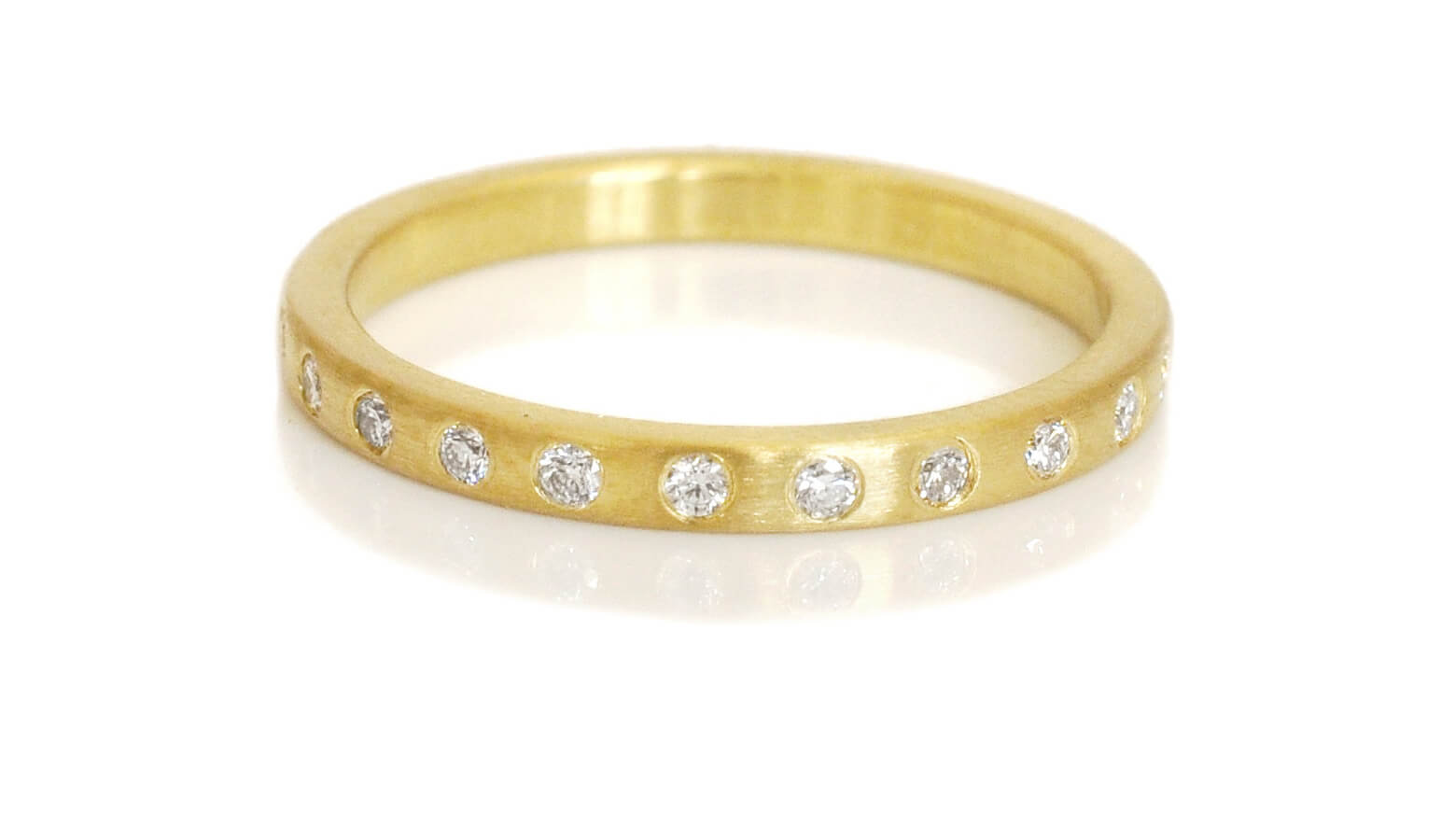 Yellow gold eternity band from EC Design Jewelry in Minneapolis, MN.