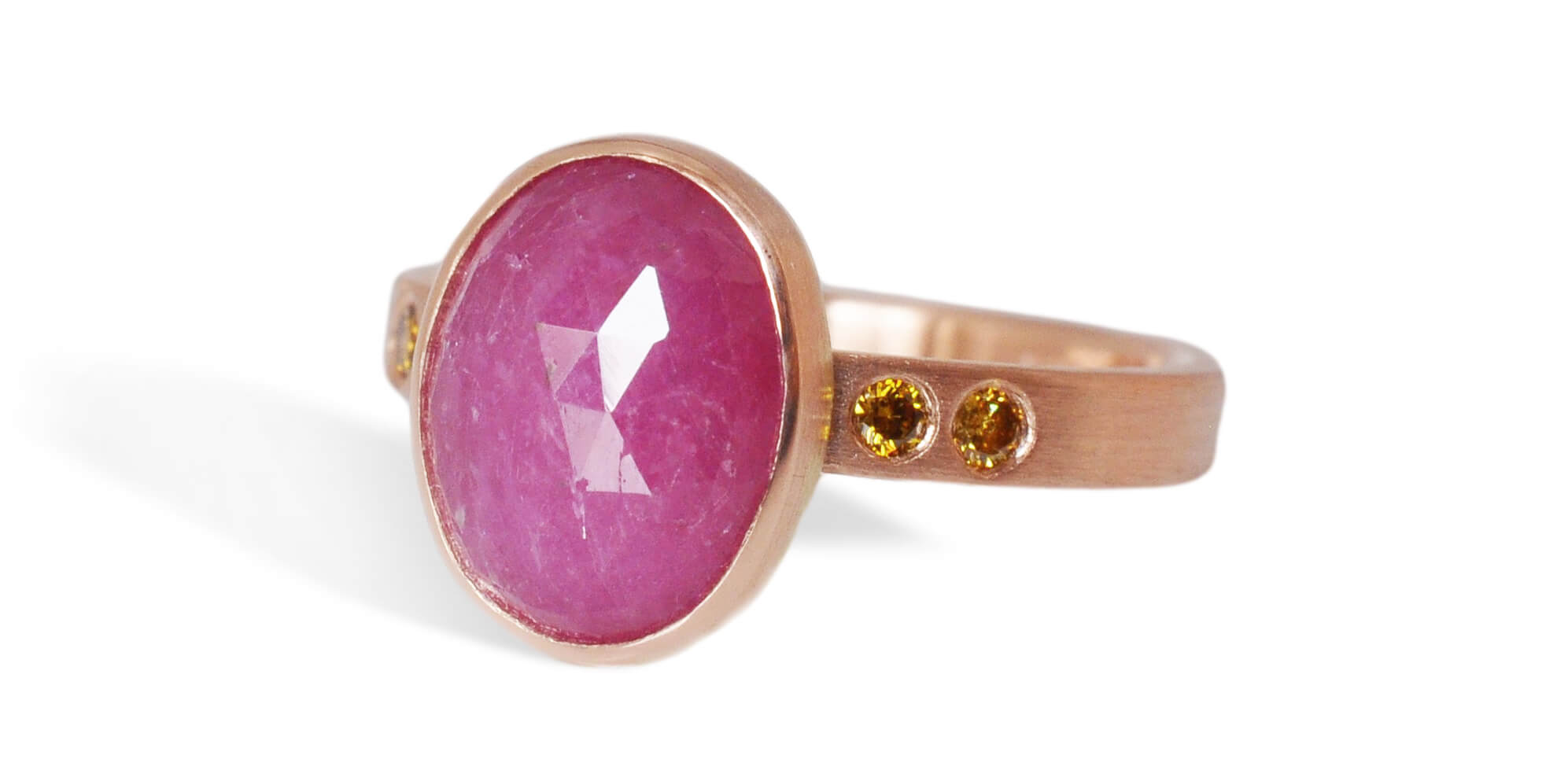 Custom pink sapphire and diamond ring in recycled red gold from EC Design in Minneapolis, MN.