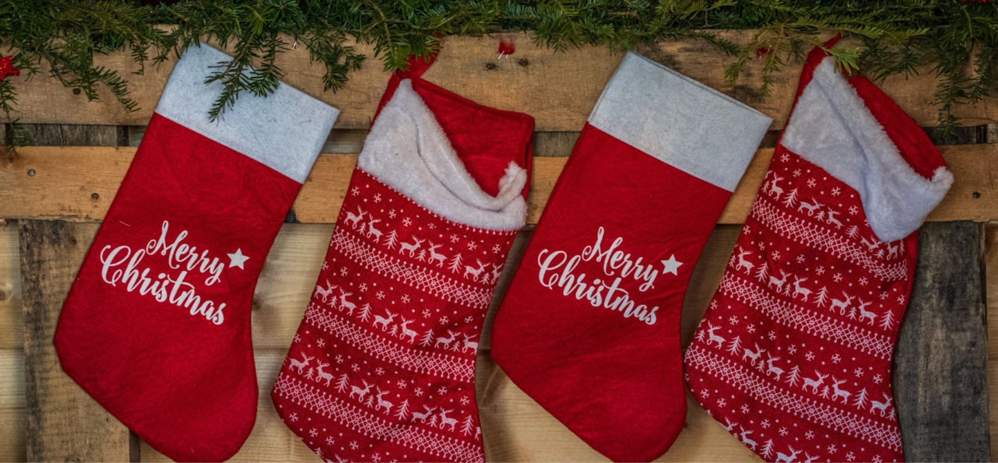 Row of four red Christmas stockings