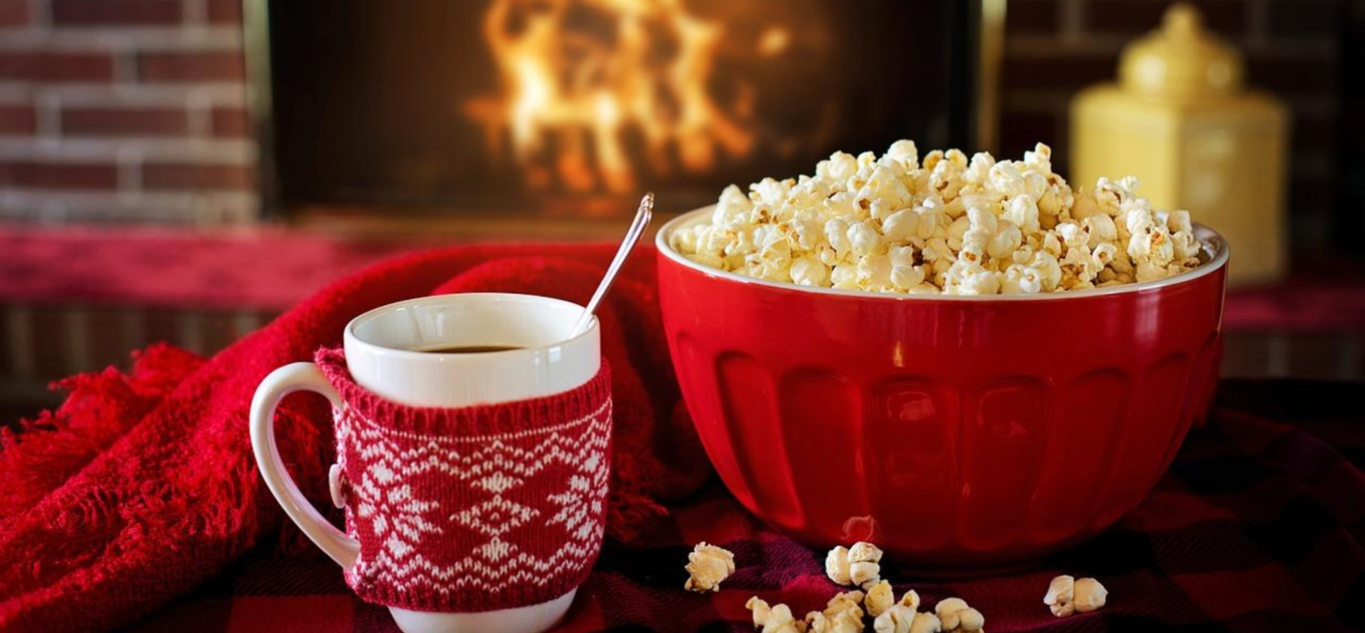 Christmas snacks, popcorn and coffee in front of a fire