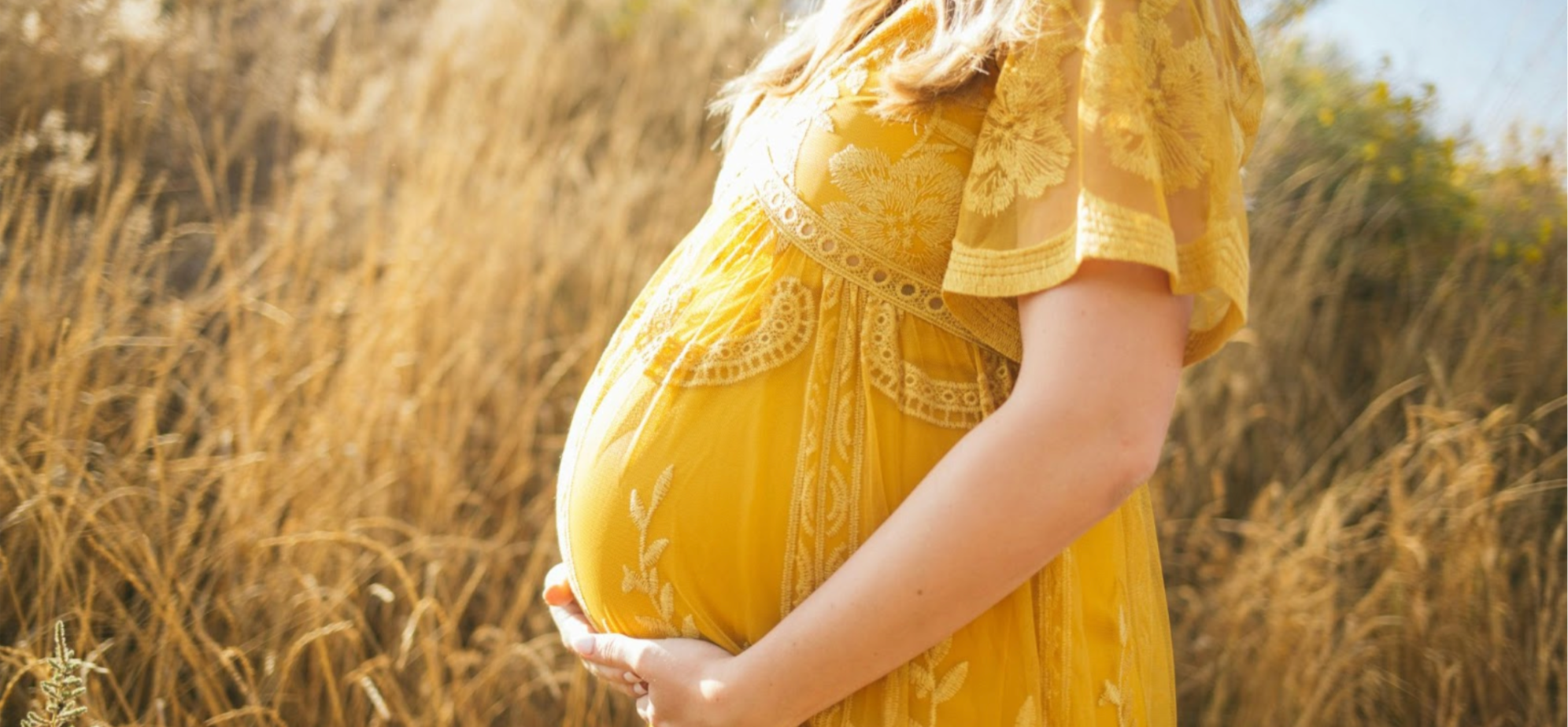 Pregnant woman in a yellow dress