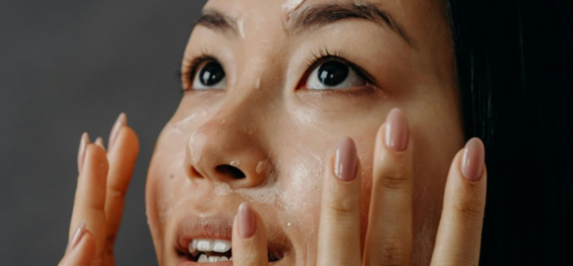 Woman with a skincare product on her face
