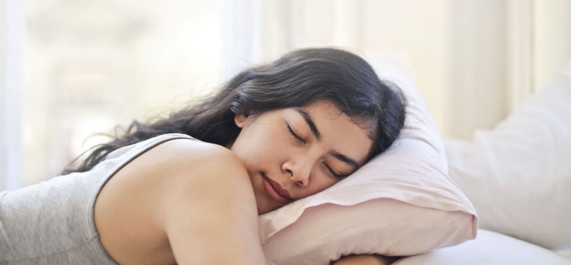 Woman with long dark hair sleeping