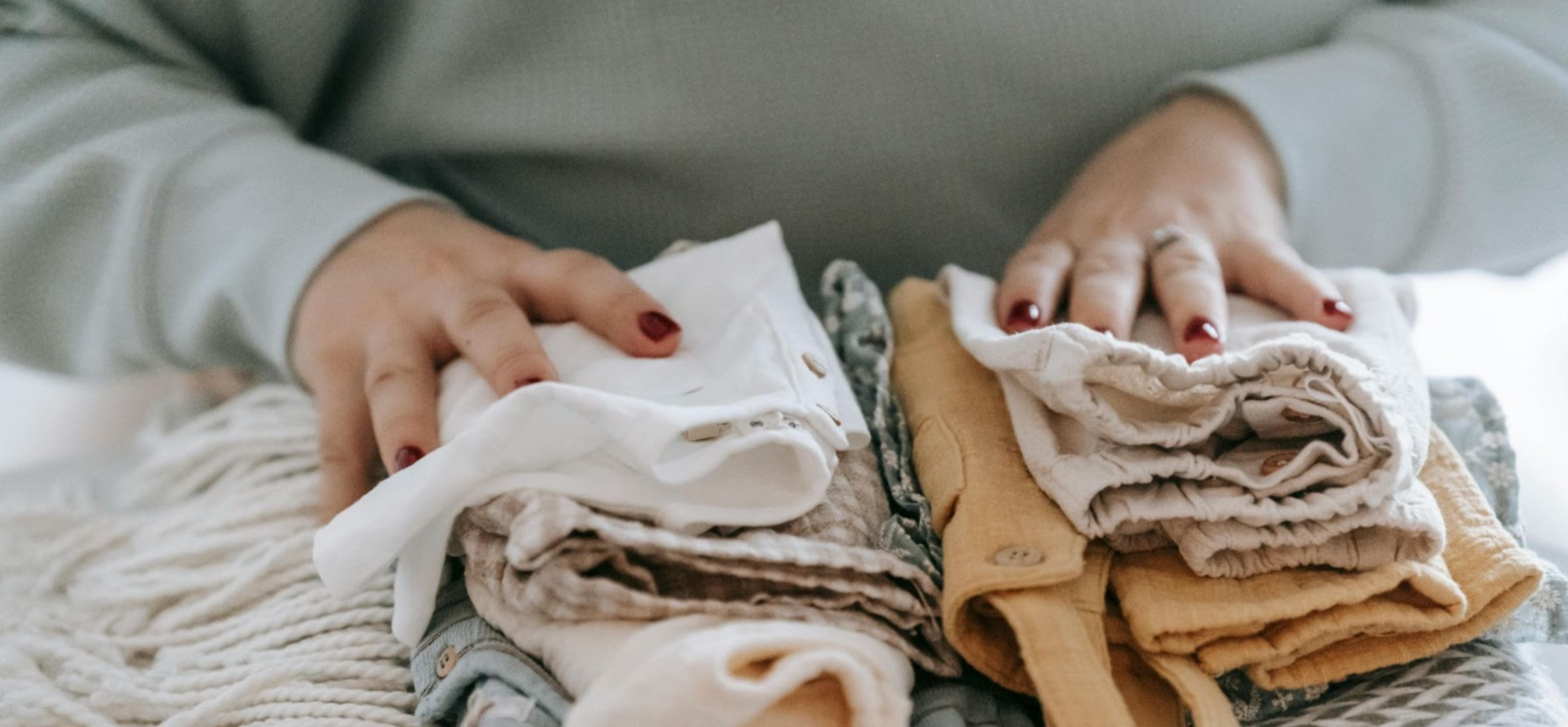 Woman folding clothes for a neat and tidy home
