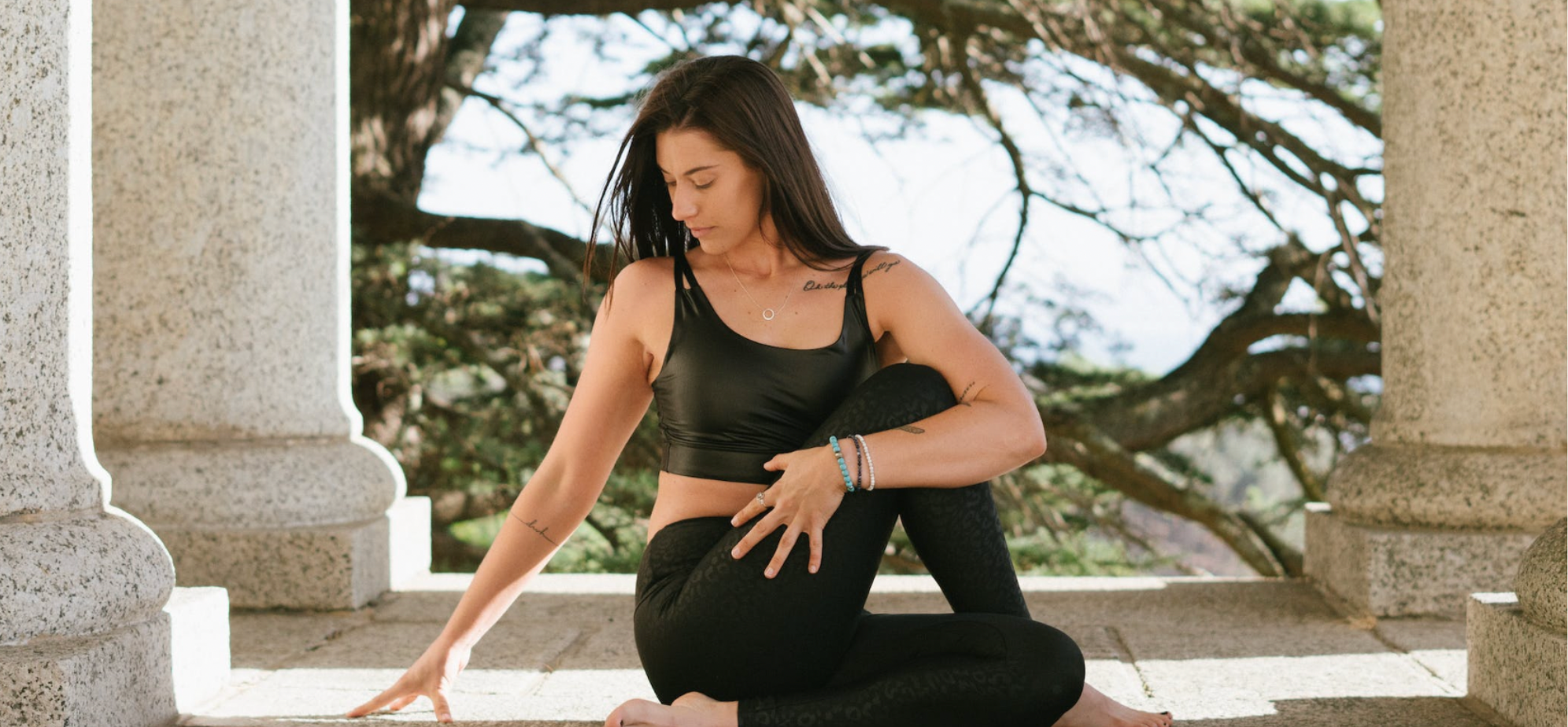 Woman doing a yoga pose outside