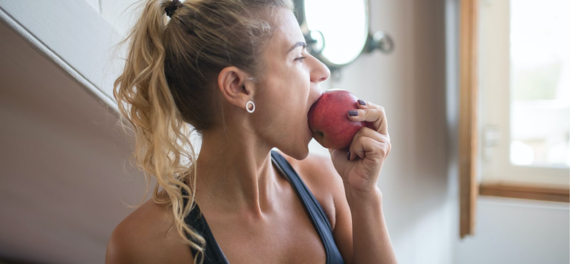 Woman eating an apple