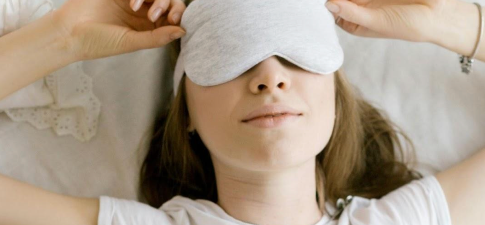 Woman sleeping wearing a facemask