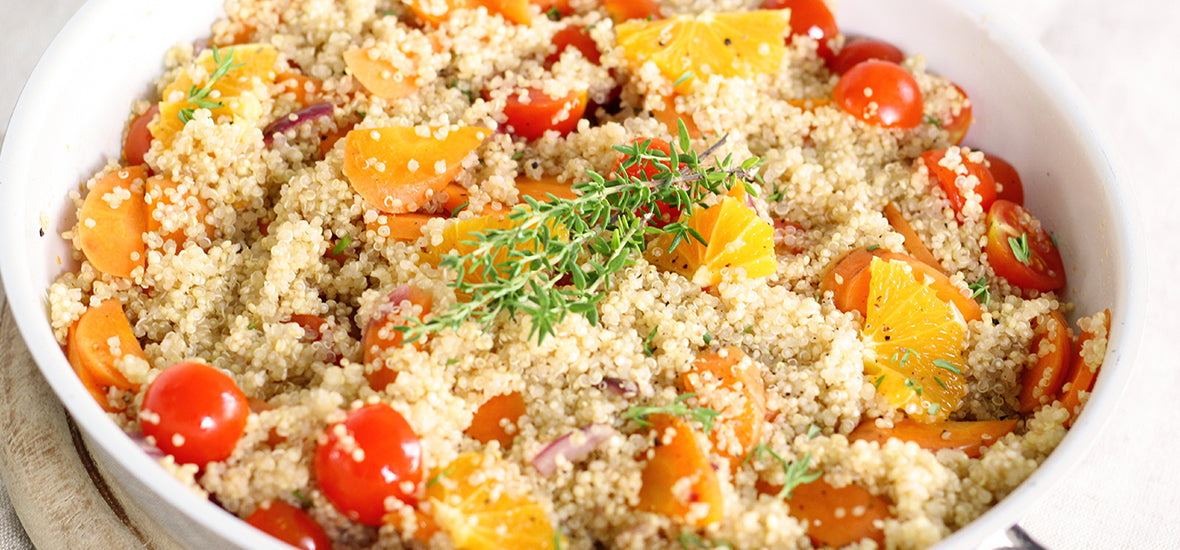 Skillet of couscous and cherry tomatoes for vegan collagen foods.