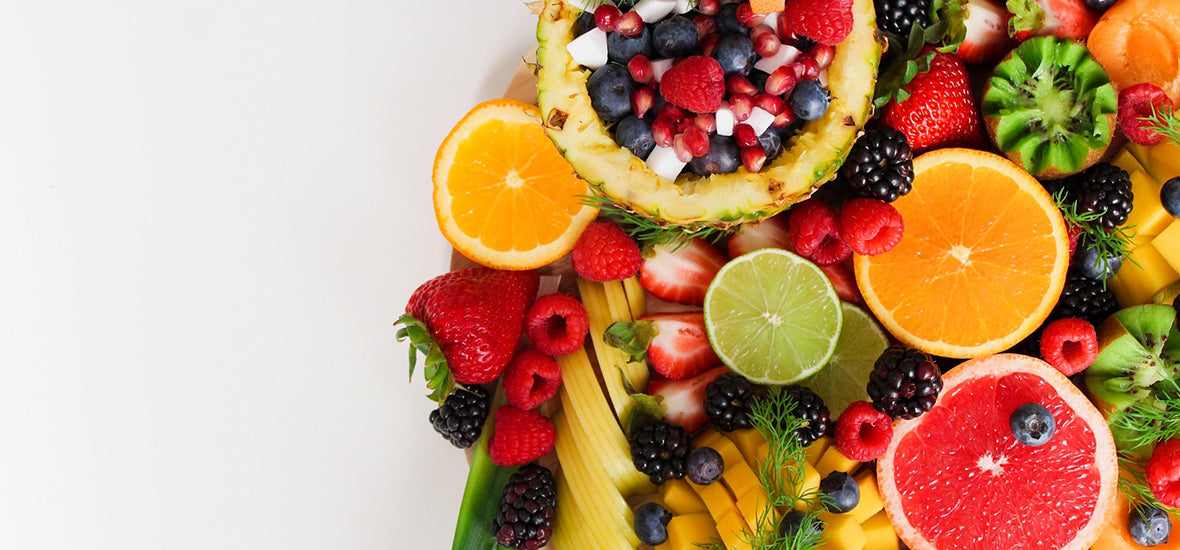 Mixture of fruit, including orange, grapefruit and lime slices, mango, kiwi and berries for heart health.