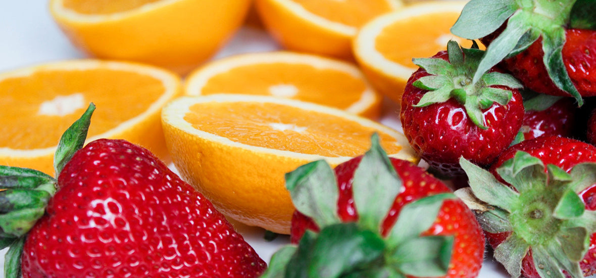Fruit for a plant-based diet - orange slices and strawberries.
