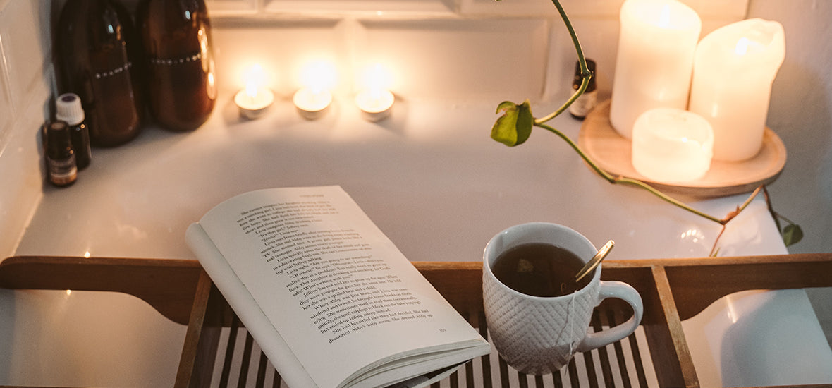 Candles, book and a cup of tea with a bubble bath to relax and unwind.