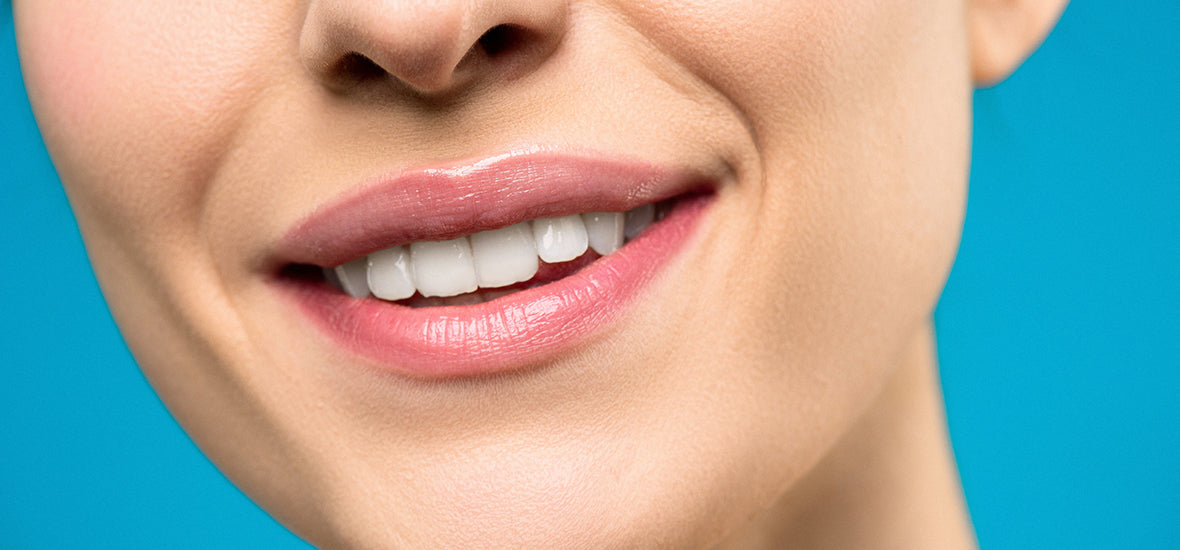 Different types of collagen - a woman with white teeth smiling.
