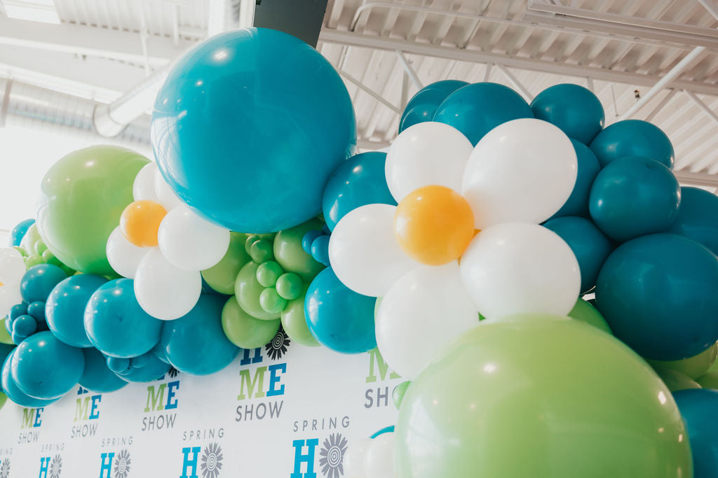 balloon installation garland  in lime green, Caribbean blue, and white.