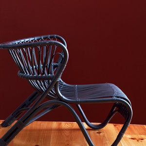 metal arm chair on a hardwood floor