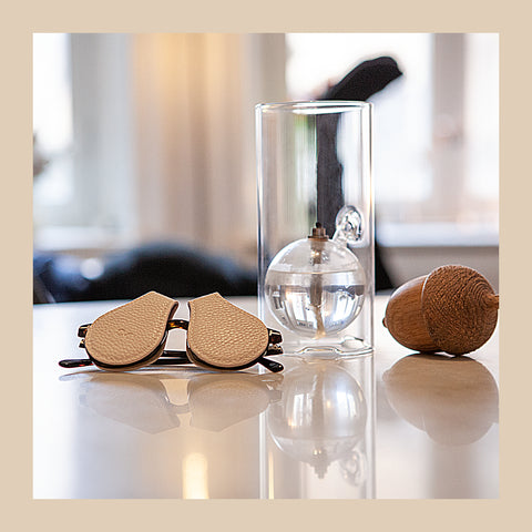 table-with-glasses-and-beige-lens-protection-and-glass-vase