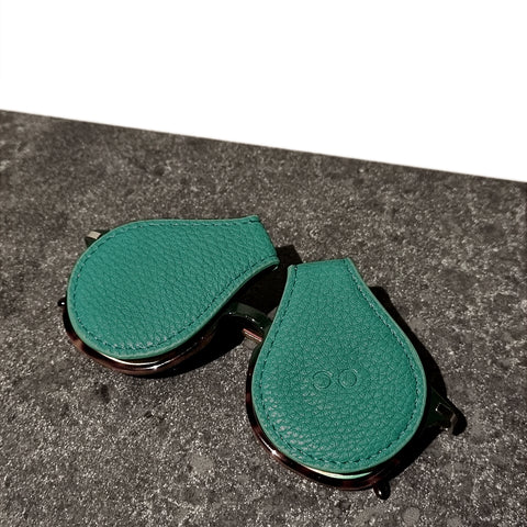 green-leather-sunglass-case-on-glasses-on-granite