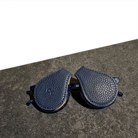 navy-blue-eyewear-protection-on-ray-ban-sitting-on-granite