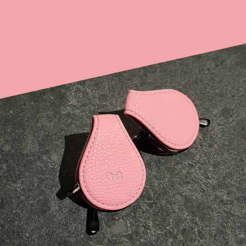 pink-sunglass-case-on-persol-sunglasses-on-granite