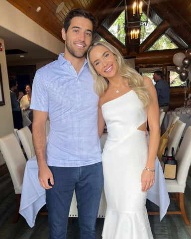 woman with man wearing thin blue check dress collar polo