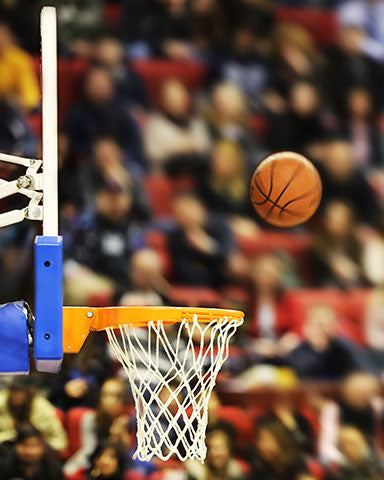 win your march madness bracket basketball midair