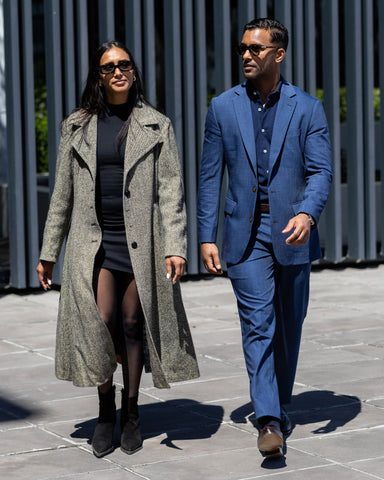 elevated tonal dressing in navy blue with woman in black tonal dressing featuring European fashion.