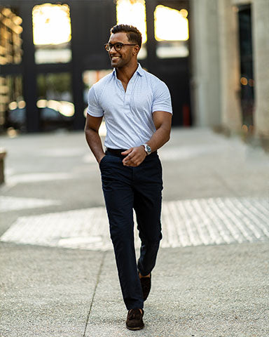 man wearing classic check polo with black slacks for hot weather kentucky derby