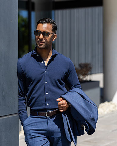 professional man wearing cotton long sleeve dress shirt outside restaurant after excellent meal