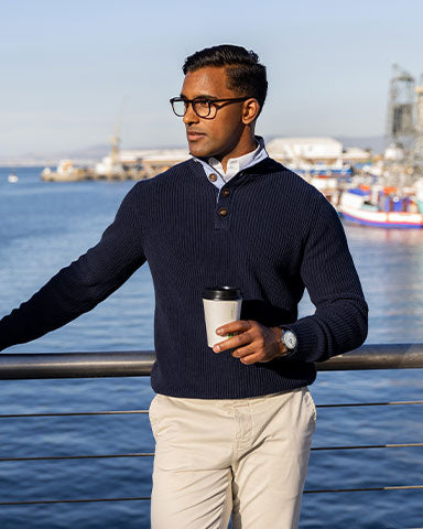 man in navy cotton sweater on boardwalk american marina yacht